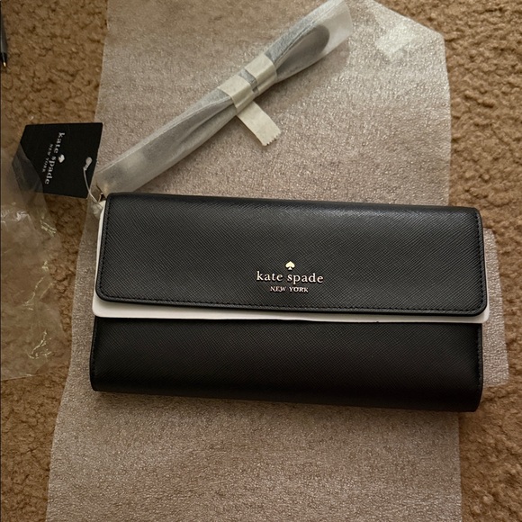 kate spade Handbags - Kate Spade Madison Travel Wallet Wristlet (black)